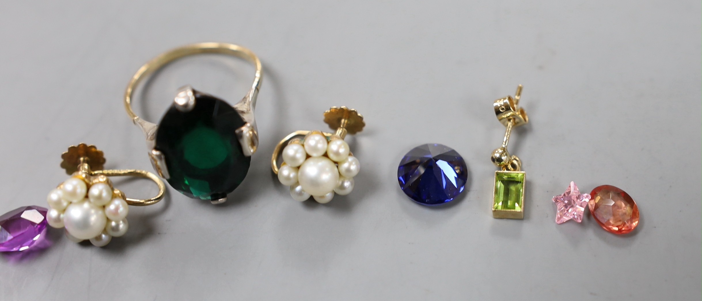 A pair of 9ct and cultured pearl cluster set ear clips, a pair of 9ct and gem set drop earrings, a 9ct and paste set dress ring and six unmounted cut stones.